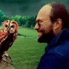 holding an owl